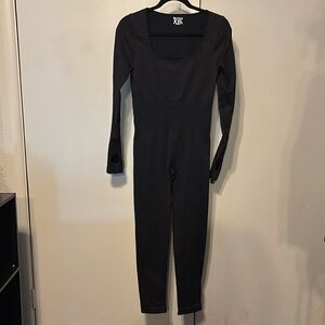 Sleek Black Long-Sleeved Jumpsuit with Tapered Legs